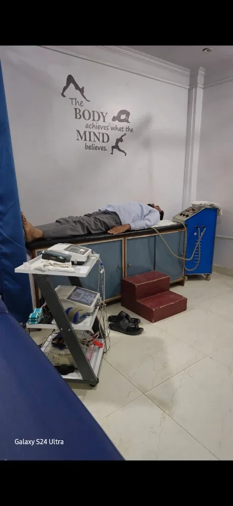 Patient receiving electrotherapy on a treatment couch at SS Physiotherapy Clinic, Rajajipuram